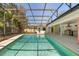 A screened-in pool with covered outdoor kitchen and plenty of space for entertaining at 111 Woodstream Ct, Maitland, FL 32751