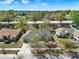 Aerial view of home showing mature trees, manicured yards, and blue skies at 1137 Stratton Ave, Groveland, FL 34736