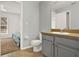 Bright bathroom showcasing modern fixtures next to bedroom at 1137 Stratton Ave, Groveland, FL 34736