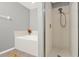 Bathroom featuring separate tub and shower at 1137 Stratton Ave, Groveland, FL 34736
