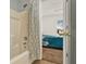 Bright bathroom showcasing a shower, tub, and view of the bedroom at 1137 Stratton Ave, Groveland, FL 34736