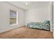 Bright bedroom with window view and ceiling fan at 1137 Stratton Ave, Groveland, FL 34736