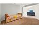 Cozy bedroom with carpeted floors and access to an adjoining living area at 1137 Stratton Ave, Groveland, FL 34736