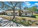 Lovely single-story house with an attached garage and well-kept landscaping at 1137 Stratton Ave, Groveland, FL 34736