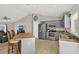 Open kitchen with a breakfast bar, stainless steel appliances, and ample cabinet space at 1137 Stratton Ave, Groveland, FL 34736