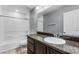 Bathroom with granite-look vanity, large mirror, and shower-tub combo at 11926 Verrazano Dr, Orlando, FL 32836