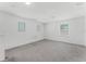 Bright bonus room featuring neutral carpet, white walls and ample natural light from the three windows at 11926 Verrazano Dr, Orlando, FL 32836