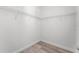 Walk-in closet with wood-look flooring and wire shelving at 11926 Verrazano Dr, Orlando, FL 32836