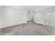 Upstairs hallway featuring neutral carpeting and bright recessed lighting, creating a tranquil transition between rooms at 11926 Verrazano Dr, Orlando, FL 32836