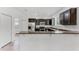 Well-equipped kitchen boasts a breakfast bar, granite countertops, and stainless steel appliances, perfect for meal prep at 11926 Verrazano Dr, Orlando, FL 32836