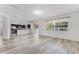 Light-filled living area showcases a contemporary kitchen and sliding glass doors that bring the outdoors inside at 11926 Verrazano Dr, Orlando, FL 32836