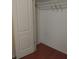 Walk-in closet interior featuring hardwood floors and white wire shelving at 12863 Holdenbury Ln, Windermere, FL 34786