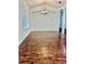 Dining room with hardwood floors, large windows, and stylish chandelier at 12863 Holdenbury Ln, Windermere, FL 34786