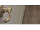 Close-up of a brass swan neck door handle, showcasing its classic design at 12863 Holdenbury Ln, Windermere, FL 34786