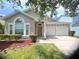 Charming single-Gathering home with a two-car garage and well-maintained landscaping at 12863 Holdenbury Ln, Windermere, FL 34786