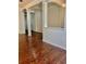 Hallway featuring hardwood floors and arched doorways at 12863 Holdenbury Ln, Windermere, FL 34786