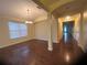 Open-concept living room with hardwood floors, and large windows for natural light at 12863 Holdenbury Ln, Windermere, FL 34786