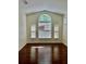 A spacious living room featuring vaulted ceilings and new hardwood floors at 12863 Holdenbury Ln, Windermere, FL 34786