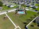 Aerial view showcasing a pool and playground in a community surrounded by well-maintained homes and landscaping at 13233 Lake Yale View Loop, Grand Island, FL 32735