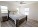 Bright primary bedroom featuring a large bed and natural light at 13233 Lake Yale View Loop, Grand Island, FL 32735