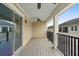 Relaxing balcony with wooden deck, fan and metal railing, perfect for outdoor enjoyment at 1341 Mill Stream Ln, Winter Springs, FL 32708