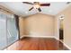Spacious bedroom featuring vaulted ceilings, hardwood floors, and a sliding glass door leading to the outside at 1341 Mill Stream Ln, Winter Springs, FL 32708
