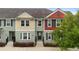 Charming townhome with colorful facade, neat landscaping, and inviting entrance at 1341 Mill Stream Ln, Winter Springs, FL 32708