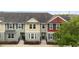 Attractive townhome showcasing colorful exteriors, well-kept lawns, and inviting entryways at 1341 Mill Stream Ln, Winter Springs, FL 32708
