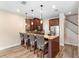 Kitchen with breakfast bar seating, stainless steel appliances, and modern fixtures at 1341 Mill Stream Ln, Winter Springs, FL 32708