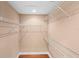 Walk-in closet with installed wire shelves and hardwood flooring providing ample storage space at 1341 Mill Stream Ln, Winter Springs, FL 32708