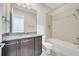 Well-maintained bathroom featuring a vanity, granite countertop, and a shower-tub combination at 13852 Maskawa Ave, Orlando, FL 32827