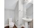 Modern half bathroom features a pedestal sink and toilet against a neutral wall at 13852 Maskawa Ave, Orlando, FL 32827