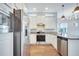 Modern kitchen featuring stainless steel appliances and light-colored cabinets at 13852 Maskawa Ave, Orlando, FL 32827