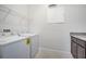 Well-lit laundry room with modern appliances and ample storage space for convenience at 13852 Maskawa Ave, Orlando, FL 32827