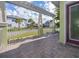 Open patio with pergola overlooking the fenced front yard, offering ample outdoor enjoyment at 13852 Maskawa Ave, Orlando, FL 32827