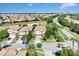 Beautiful aerial view of a suburban neighborhood featuring lush landscaping and well-maintained homes at 1400 Moon Valley Dr, Davenport, FL 33896