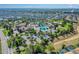 Aerial view of a community pool area with pools, landscaping, and lounge chairs at 1400 Moon Valley Dr, Davenport, FL 33896