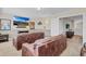 Finished basement featuring comfortable seating and a large screen television at 1400 Moon Valley Dr, Davenport, FL 33896