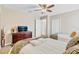 Bedroom includes two twin beds and dresser with a view into a hallway and closet at 1400 Moon Valley Dr, Davenport, FL 33896