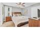 Bedroom with large bed, neutral colors, ensuite bathroom, and closet at 1400 Moon Valley Dr, Davenport, FL 33896