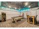 Fun game room with pool table, foosball, arcade machine and custom ceiling at 1400 Moon Valley Dr, Davenport, FL 33896