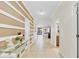 Inviting foyer with tile flooring and decorative wall trim, leading to an open living space at 1400 Moon Valley Dr, Davenport, FL 33896