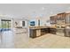 Open-concept kitchen with granite counters and view to living area and pool at 1400 Moon Valley Dr, Davenport, FL 33896