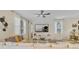 Bright living room with stylish decor, ceiling fan, and a cozy seating area at 1400 Moon Valley Dr, Davenport, FL 33896