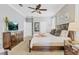 Comfortable main bedroom with king bed, ceiling fan, and neutral color scheme at 1400 Moon Valley Dr, Davenport, FL 33896