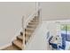 View of a carpeted staircase and the dining area with seating for eight at 1400 Moon Valley Dr, Davenport, FL 33896