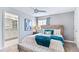 Cozy bedroom with a comfortable bed and access to the ensuite bathroom at 1563 Sandbagger Dr, Davenport, FL 33896