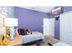 Charming bedroom with cartoon character wallpaper, flat screen TV, and closet at 1563 Sandbagger Dr, Davenport, FL 33896
