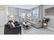 Serene living room with neutral colors, plush seating, and abundant natural light at 1563 Sandbagger Dr, Davenport, FL 33896