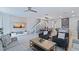 Open-concept living area with modern furnishings and ample space for relaxation and entertaining at 1563 Sandbagger Dr, Davenport, FL 33896